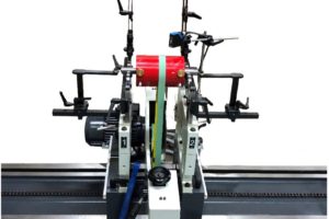 Rotor balancing being performed by machine on white background